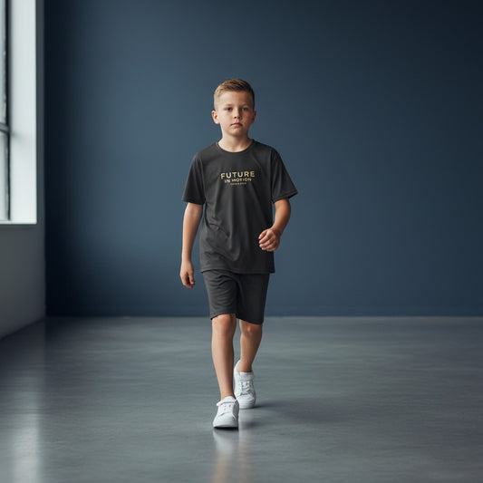 Omina Kids black cotton t-shirt with "FUTURE IN MOTION OMINA KIDS" text in gold.