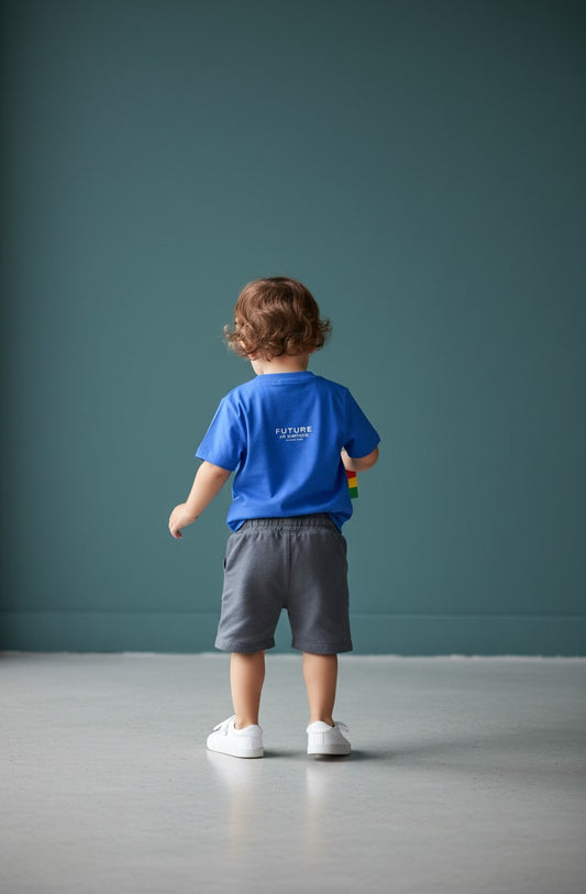 OMINA Kids toddler blue cotton tee with "FUTURE IN MOTION" graphic on back. Comfortable, breathable, and durable for play.