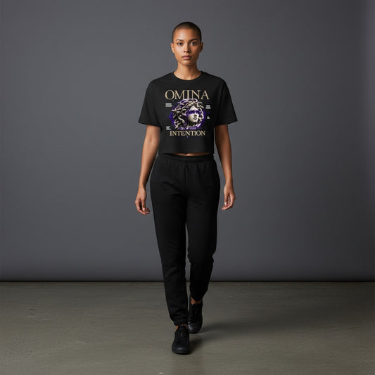 OMINA Studio black cropped heavyweight tee with Medusa graphic and "Move With Intention" text.