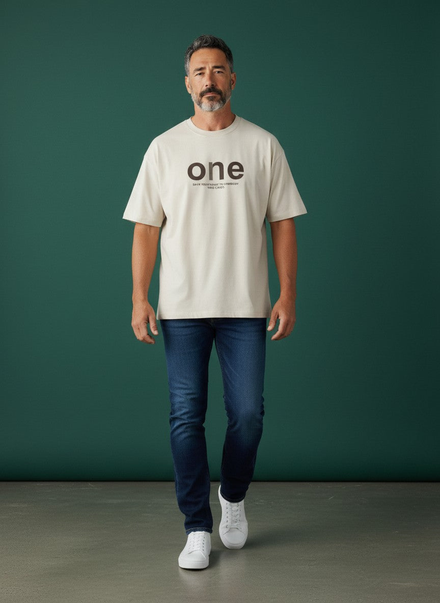 Omina men's oversized beige short-sleeve t-shirt with 'one' graphic and text.