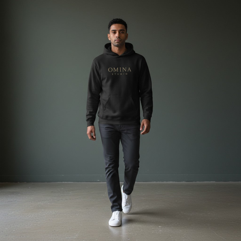 Omina Studio black cotton-blend hoodie with embroidered Omina Studio logo on the chest and a large graphic on the back.