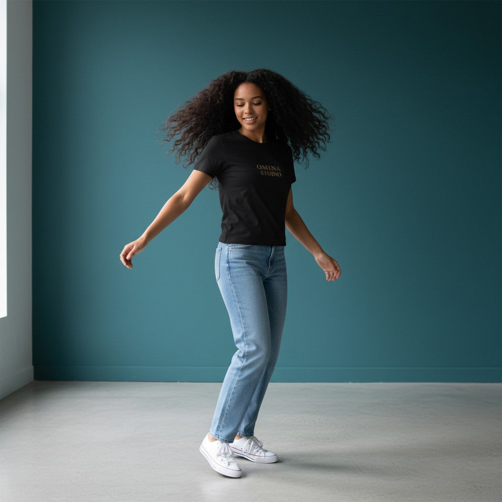 Omina black cotton-spandex blend crewneck t-shirt with "OMINA STUDIO" logo printed on chest. Bodycon fit.