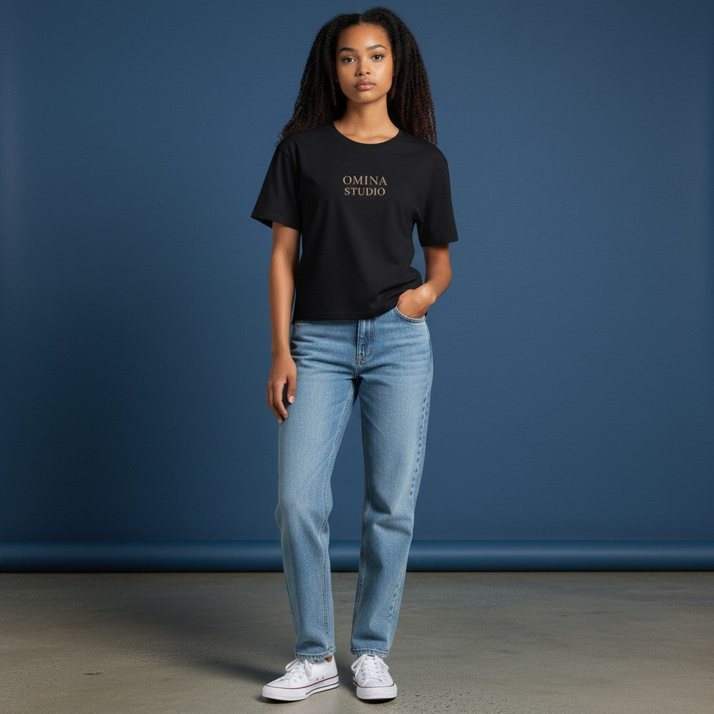 Omina black cotton-spandex blend crewneck t-shirt with "OMINA STUDIO" printed on chest. Bodycon fit.