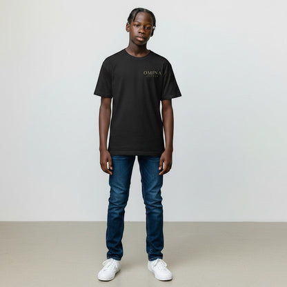 Omina Studio black premium cotton t-shirt with minimalist gold logo on the chest, worn by a young person.