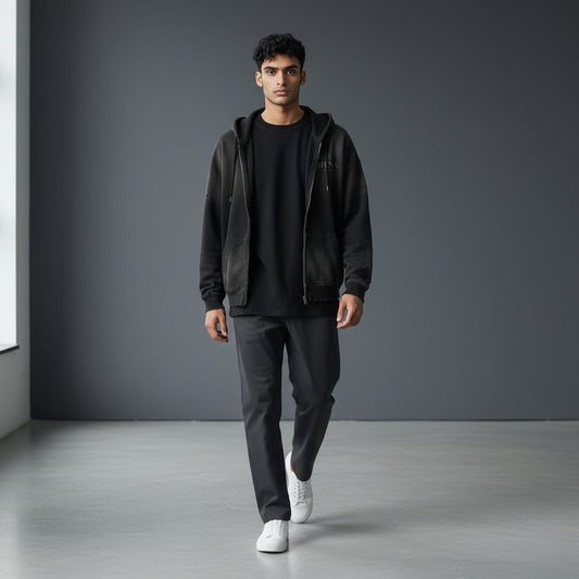 Omina black distressed zip-up hoodie with faded graphic and front pocket. Streetwear style.
