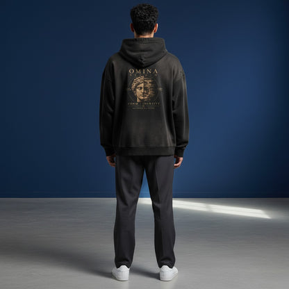 Omina Studio black faded graphic hoodie with a distressed, art-forward design featuring a split Roman bust and text.