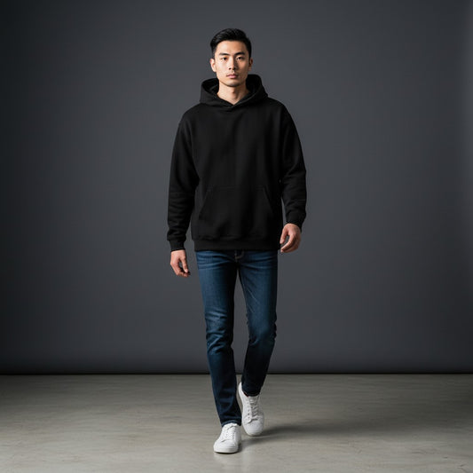 Omina Studio black heavyweight fleece drop-shoulder hoodie with front pocket and double-layer hood.