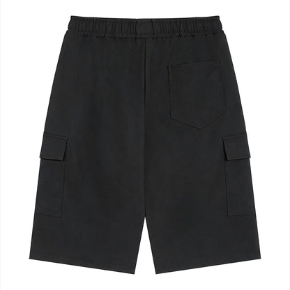 Omina black polyester unisex cargo shorts with elastic waistband and drawstring, featuring functional cargo pockets.