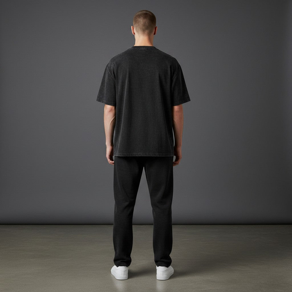 Omina black mineral wash waffle knit t-shirt with relaxed fit and drop shoulders.