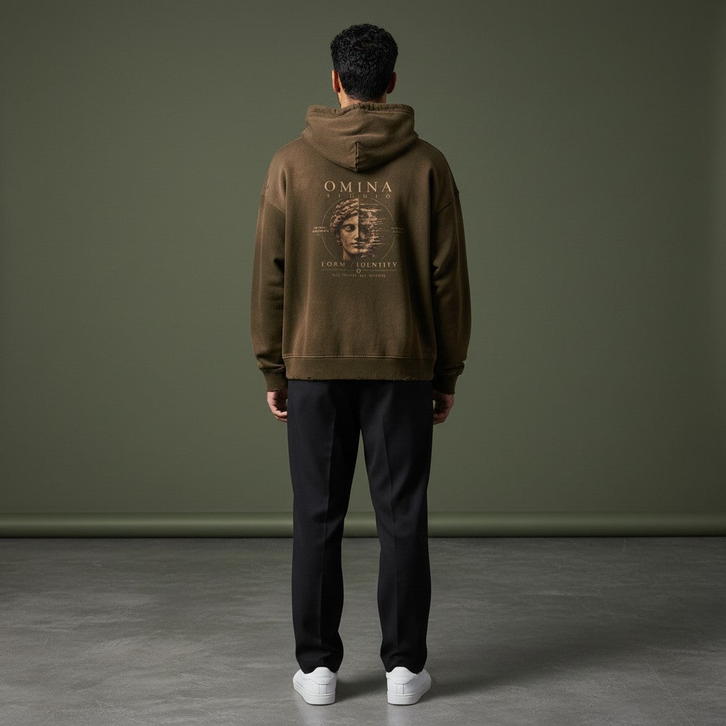 Omina Studio brown faded cotton hoodie with 'Form / Identity' graphic and distressed details.
