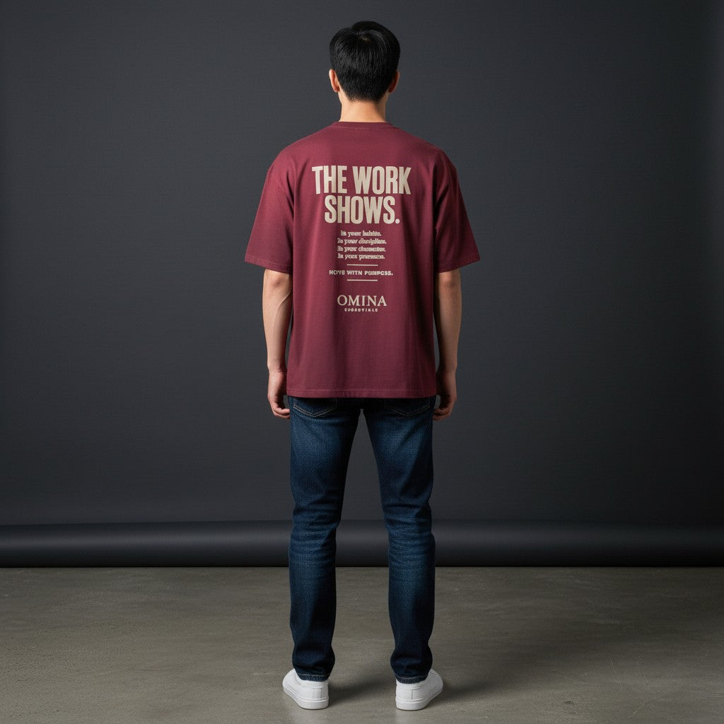 Omina burgundy cotton t-shirt with "The Work Shows" graphic print on back. Relaxed fit.