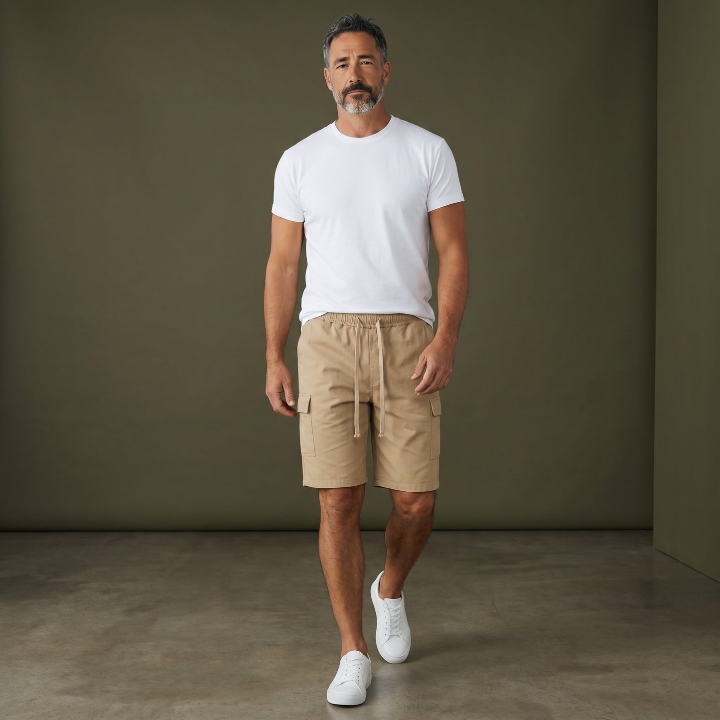Omina beige polyester cargo shorts with drawstring elastic waistband and functional side pockets. Relaxed unisex fit.