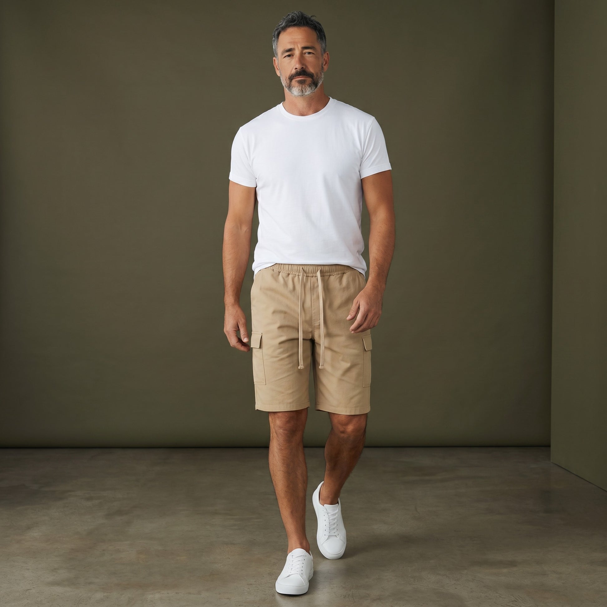 Omina beige polyester cargo shorts with drawstring elastic waistband and functional side pockets. Relaxed unisex fit.