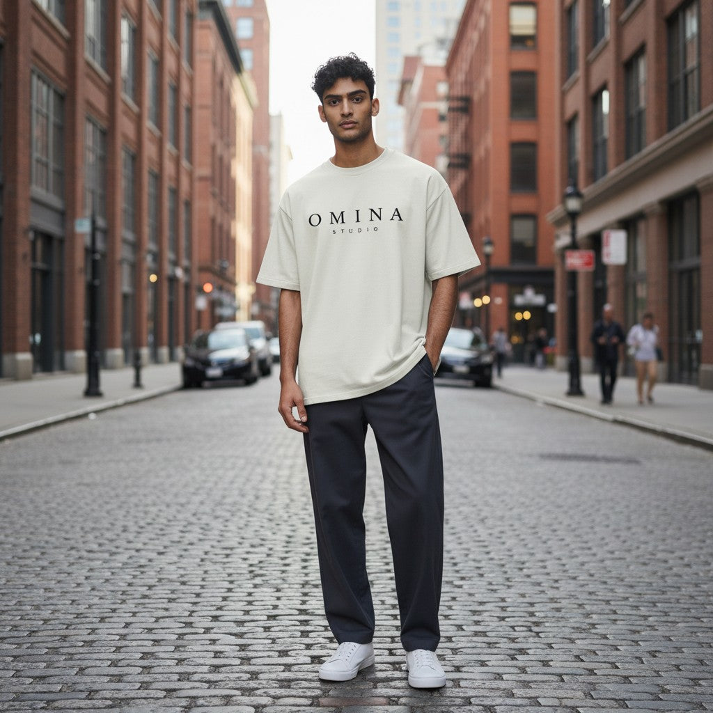 Omina Studio cream heavyweight cotton t-shirt with dropped shoulders and relaxed fit, worn by a male model.