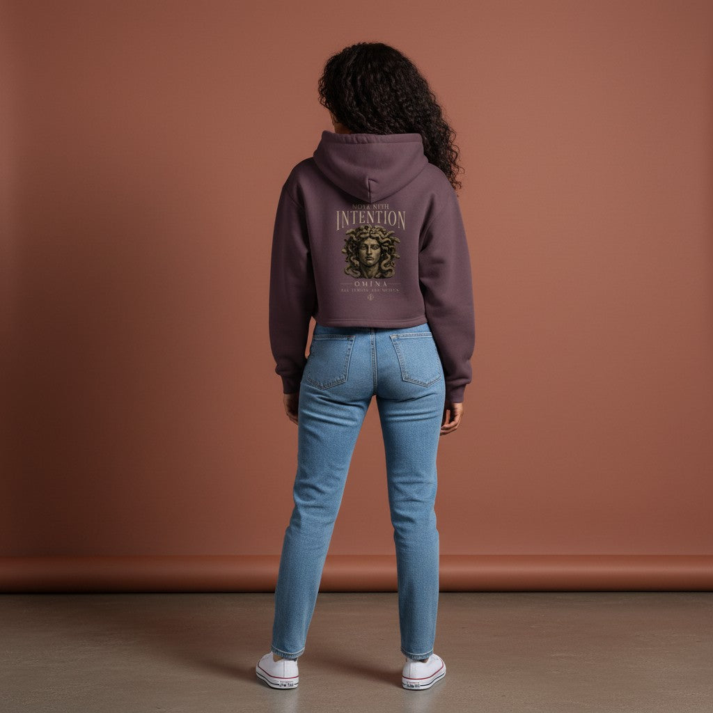 Omina dark plum cropped zip hoodie with hood, featuring "Move With Intention" graphic and Medusa head.