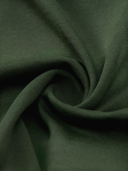 Omina Studio dark green cotton boxy t-shirt fabric detail. Soft, premium cotton with a structured drape.