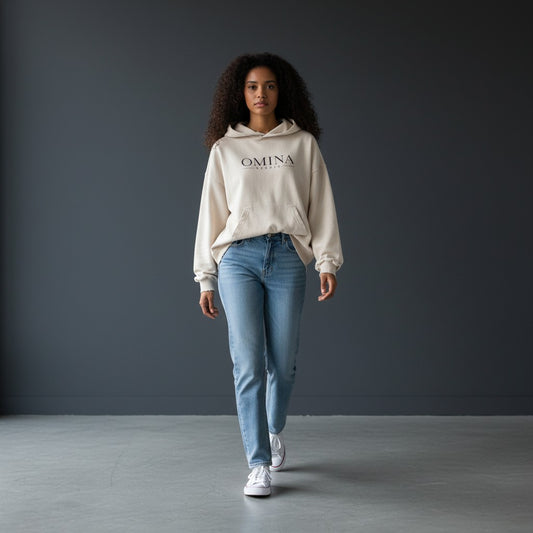 Omina oversized distressed cream cotton hoodie with frayed details and Omina Studio logo.