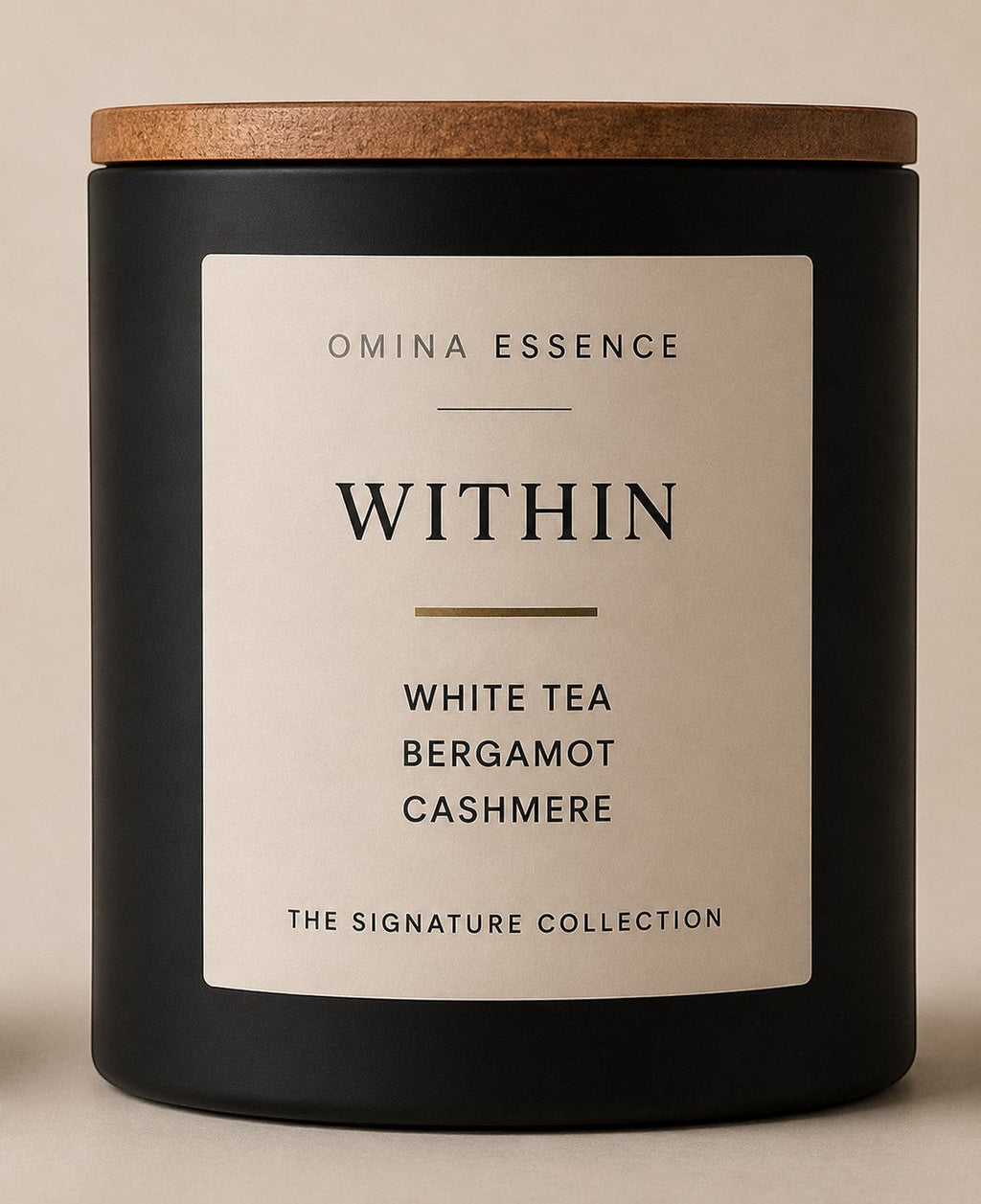 Omina Essence black candle with a wooden lid, featuring a cream label with "WITHIN" and scent notes of white tea, bergamot, and cashmere.
