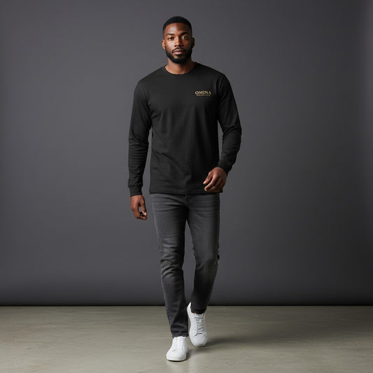 Omina Essentials black long-sleeve t-shirt made from a cotton blend with a relaxed fit and crewneck. Features a small gold logo on the chest.