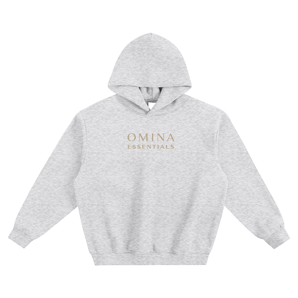 Omina Essentials light grey fleeced boxy hoodie with gold logo on chest and drop shoulders.