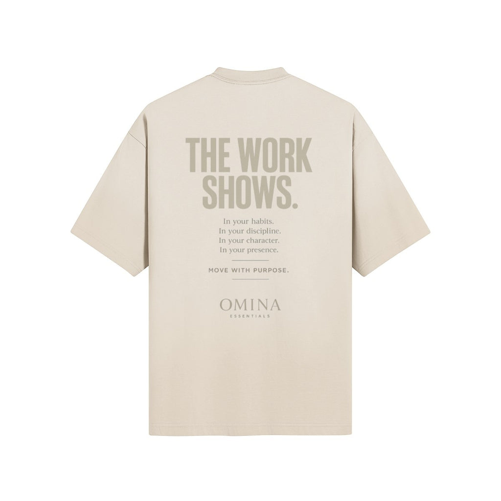 Omina Essentials The Work Shows T-Shirt in beige cotton with graphic text on back.