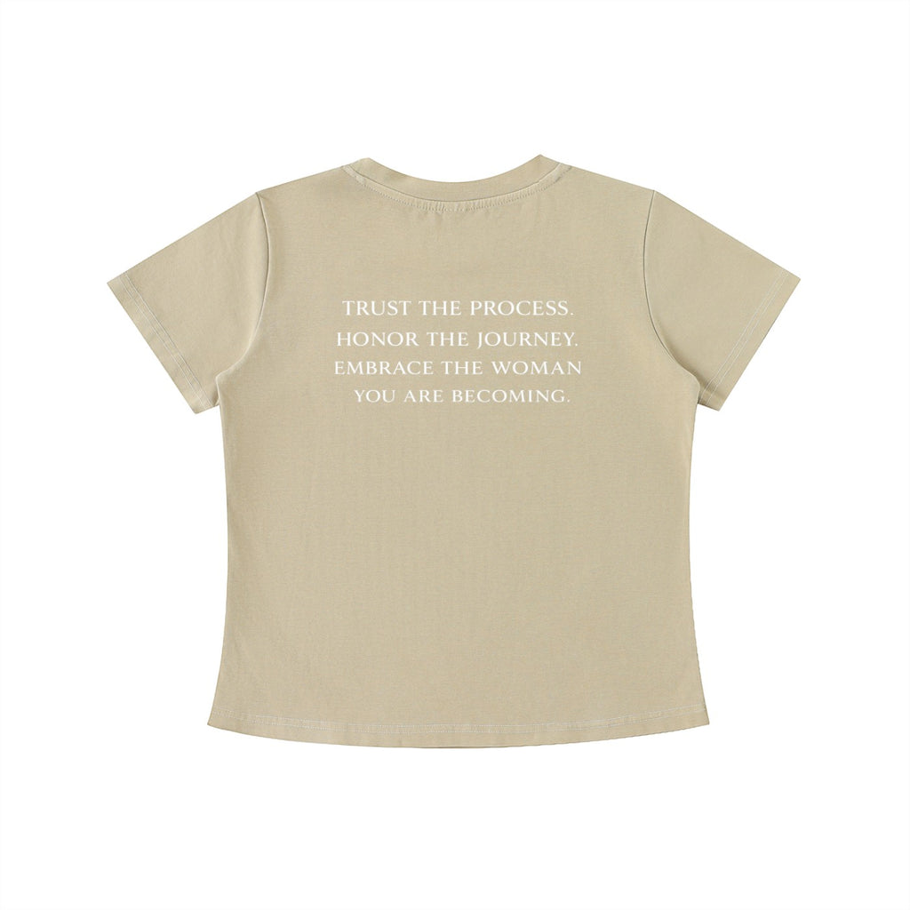 OMINA Essentials beige cotton t-shirt with vintage wash and white text on back: "TRUST THE PROCESS. HONOR THE JOURNEY. EMBRACE THE WOMAN YOU ARE BECOMING."