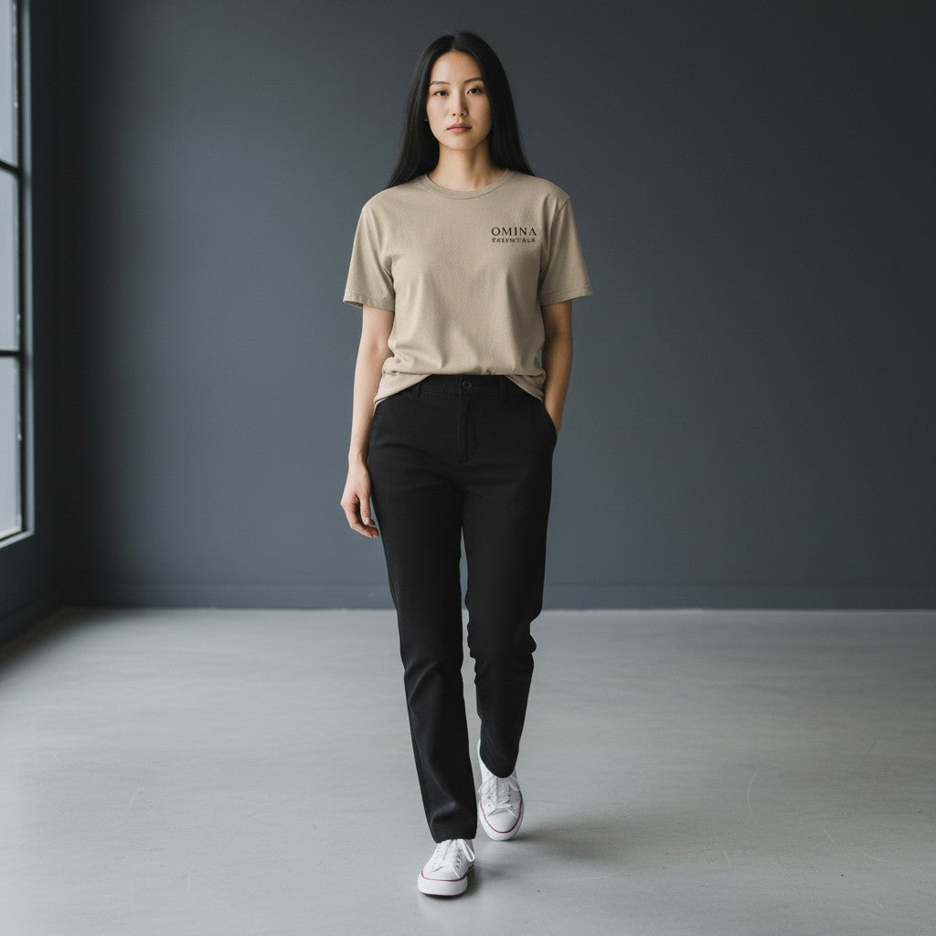 Omina Essentials women's soft taupe short-sleeve tee with minimalist logo on left chest.