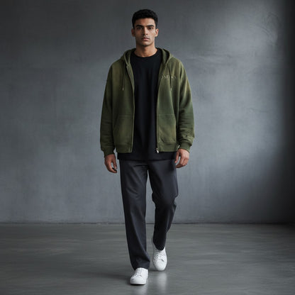 Omina Studio faded olive green distressed zip-up hoodie with front pockets and subtle logo detail.