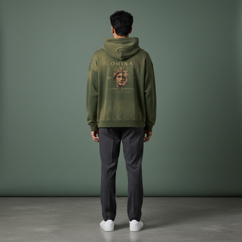 Omina Studio faded olive green cotton hoodie with 'Form / Identity' graphic and distressed details.