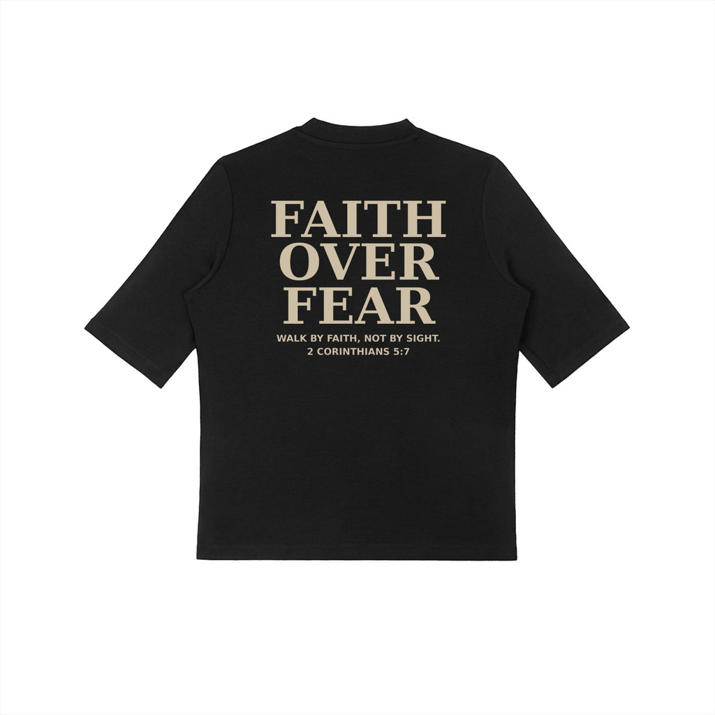 OMINA Studio black crop t-shirt with "FAITH OVER FEAR" and Bible verse 2 Corinthians 5:7 printed on back.