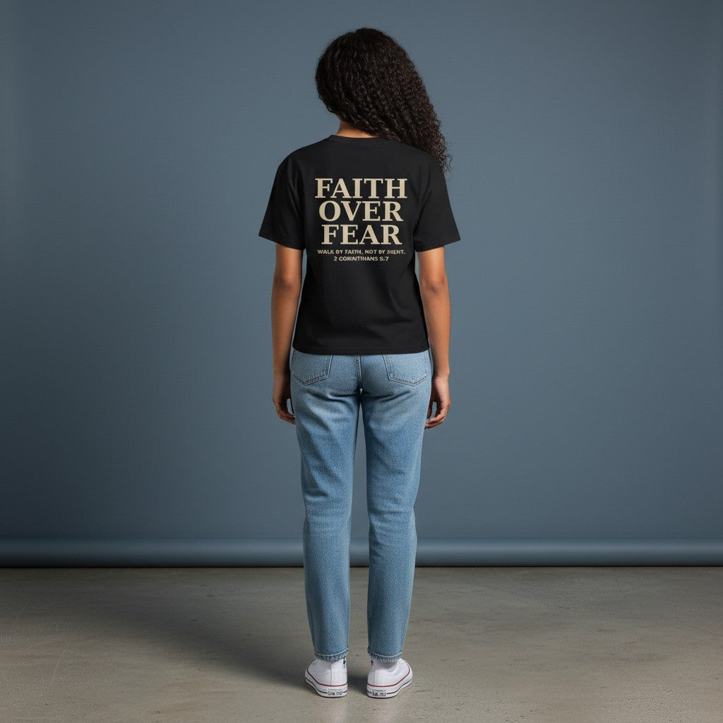 Omina black cotton blend crewneck t-shirt with "Faith Over Fear" graphic and Bible verse 2 Corinthians 5:7 on back.