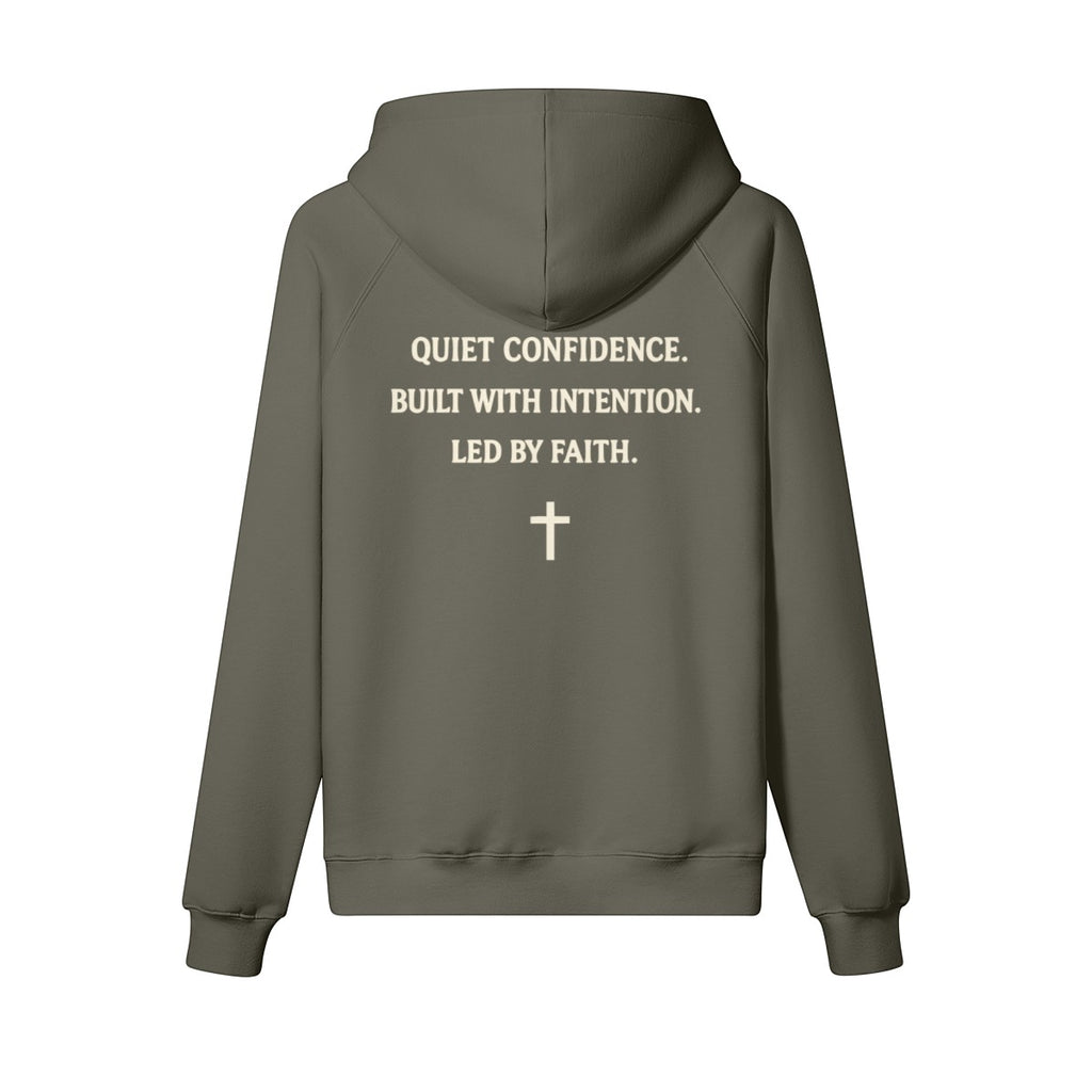 Omina Studio olive green heavyweight cotton pullover hoodie with "Quiet Confidence. Built With Intention. Led By Faith." text and a cross graphic.