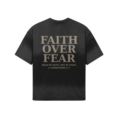 OMINA Studio black heavyweight cotton t-shirt with "FAITH OVER FEAR" graphic and Bible verse 2 Corinthians 5:7.