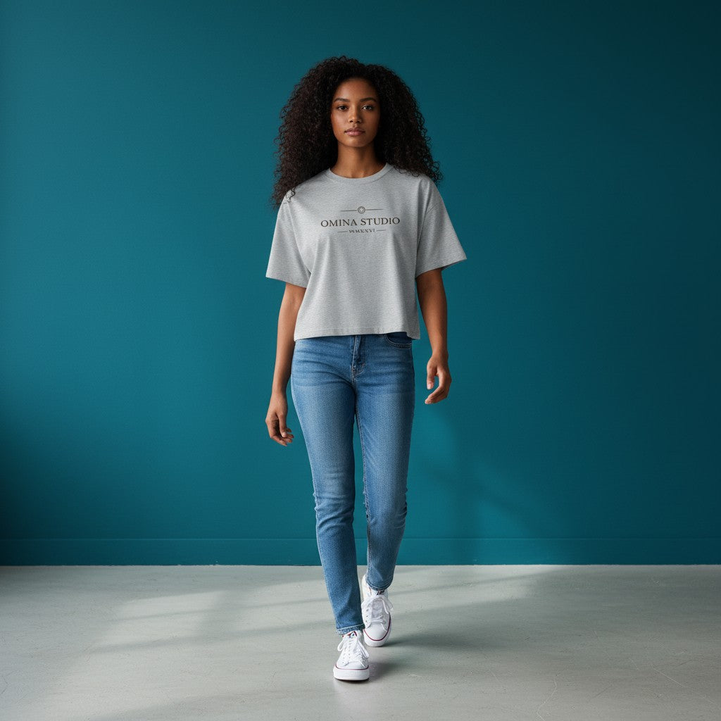 Omina Studio light grey cotton blend cropped t-shirt with Omina Studio logo and Roman numerals MMXXVI on the front.