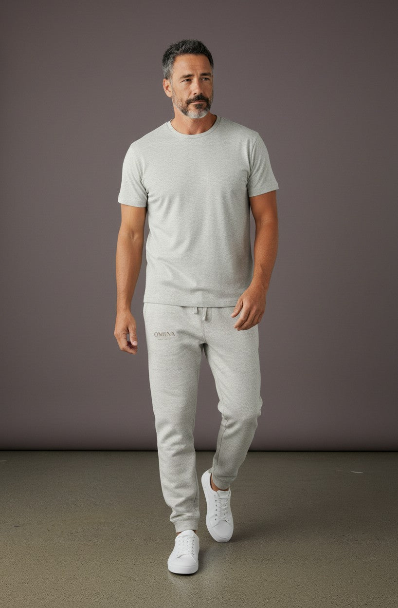 Omina Studio light grey heavyweight cotton-blend fleece sweatpants with a relaxed fit and subtle Omina branding.