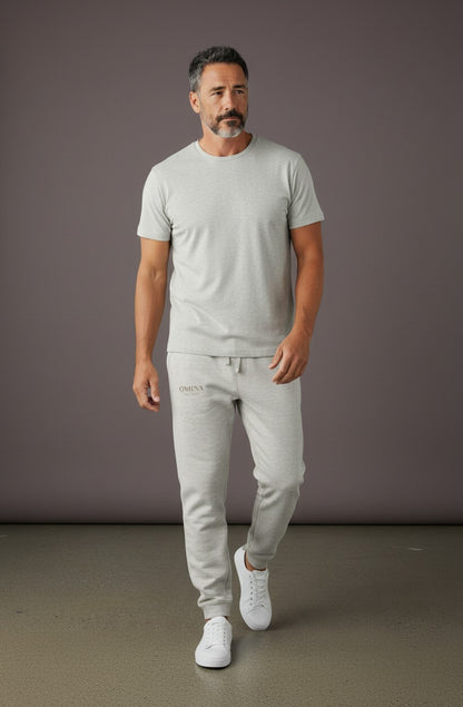 Omina Studio light grey heavyweight cotton-blend fleece sweatpants with a relaxed fit and subtle Omina branding.