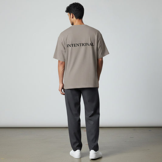 Omina grey heavyweight cotton oversized fit t-shirt with 'INTENTIONAL' printed on the back in black.