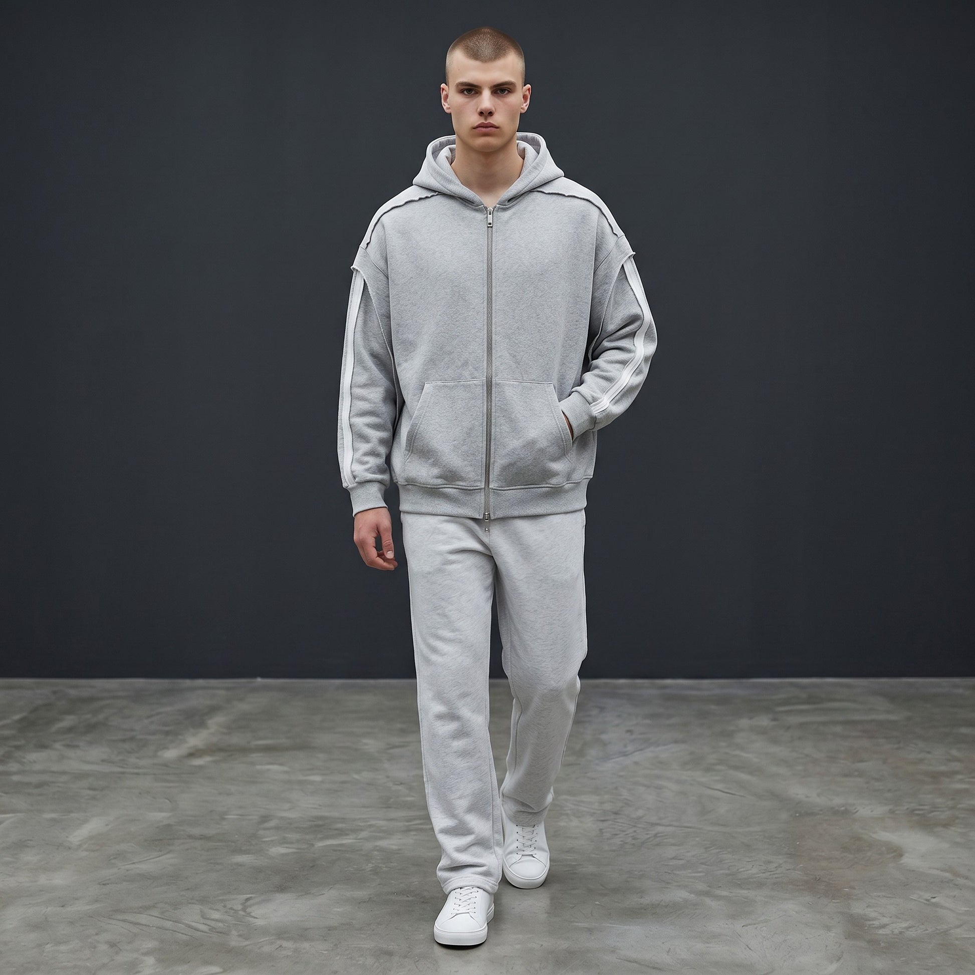 Omina grey cotton-blend zip-up hoodie with raw edge detailing and contrast tape on sleeves. Oversized fit.