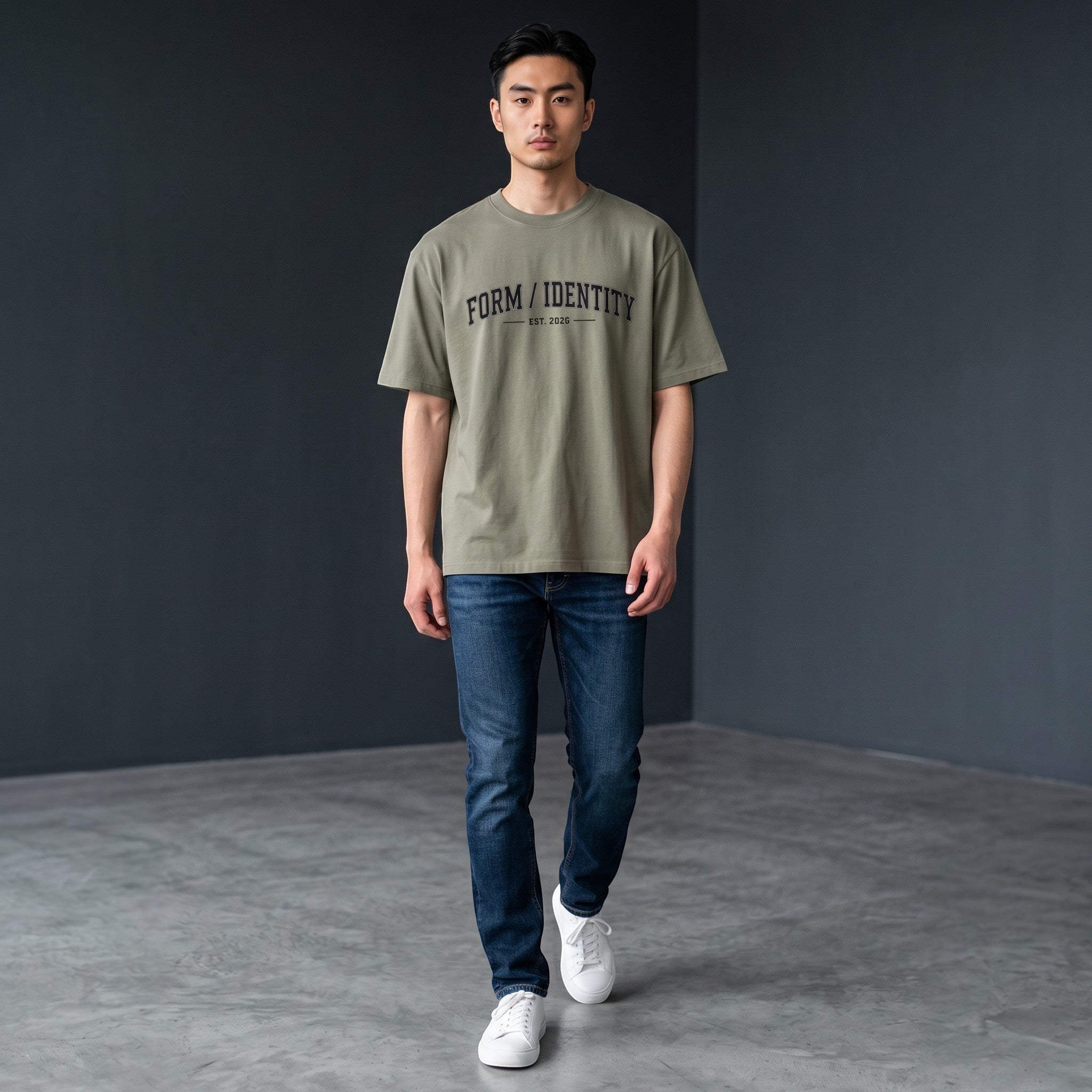 OMINA Studio heavyweight cotton t-shirt in olive green with "FORM / IDENTITY EST. 2026" graphic on front.