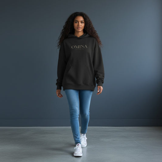 OMINA Studio heavyweight black cotton hoodie with kangaroo pocket and minimalist front logo. Boxy fit.