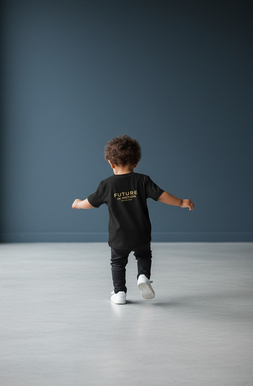 OMINA Kids black cotton t-shirt with "FUTURE IN MOTION OMINA KIDS" text on back.