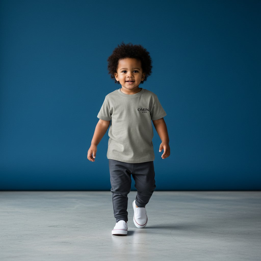 Omina Kids toddler tee in grey triblend fabric with "SMALL HUMAN. BIG ENERGY." graphic on chest.