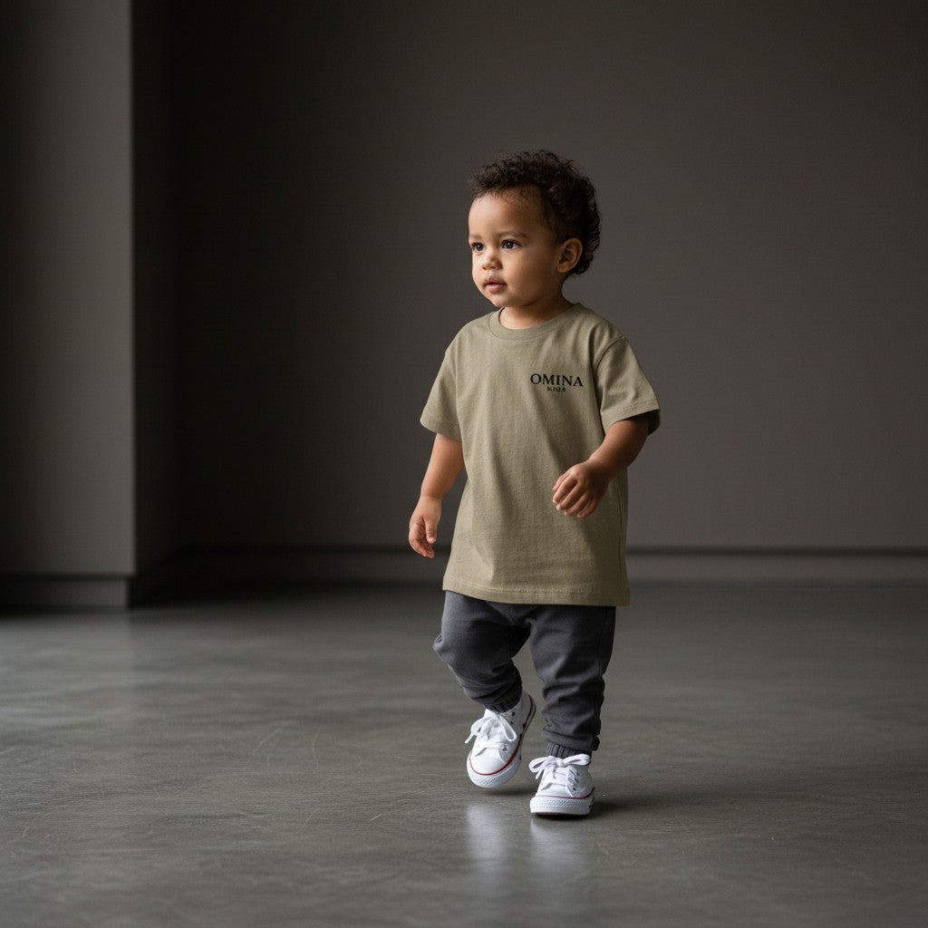 Omina Kids toddler tee in olive green triblend fabric with "SMALL HUMAN. BIG ENERGY." graphic on back.
