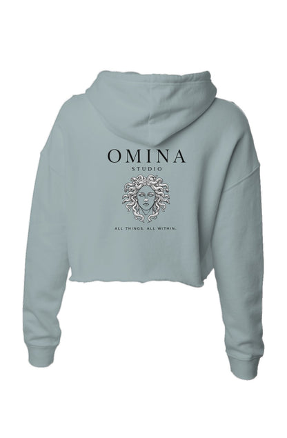 Omina Studio light blue lightweight cropped hoodie with adjustable drawstring hood and raw hem. Features graphic.