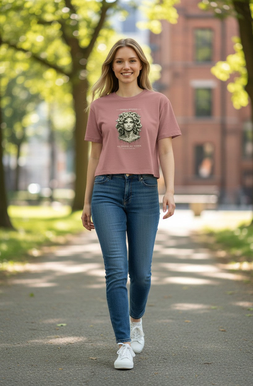 Omina dusty rose cotton crop tee with Medusa graphic print and "All Things All Within" text.