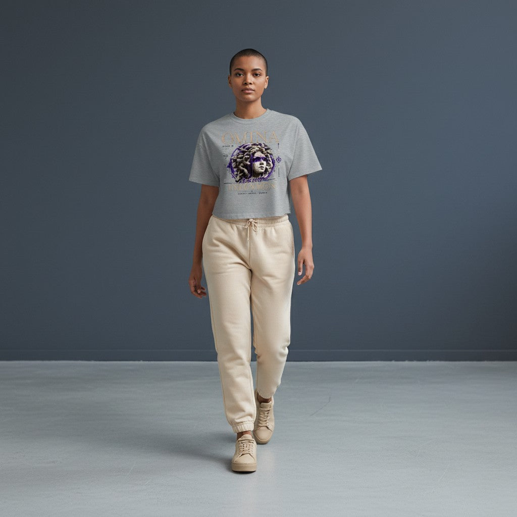 Omina grey cropped heavyweight tee with Medusa graphic and "Move With Intention" text.