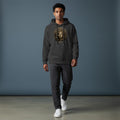Omina charcoal grey cotton blend hoodie with a striking metallic gold Medusa graphic and drawstring hood.