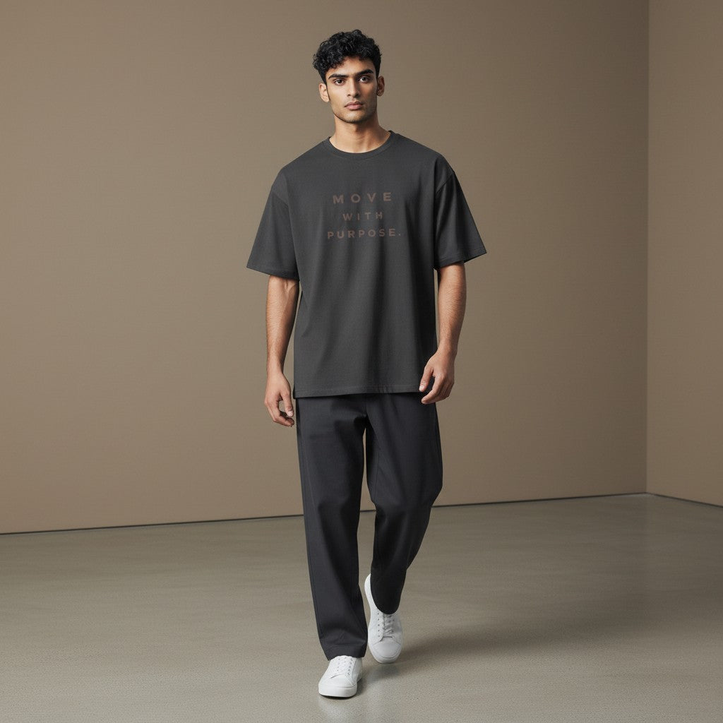 Omina dark grey heavyweight cotton t-shirt with "MOVE WITH PURPOSE." text graphic on chest. Relaxed fit, crew neck.