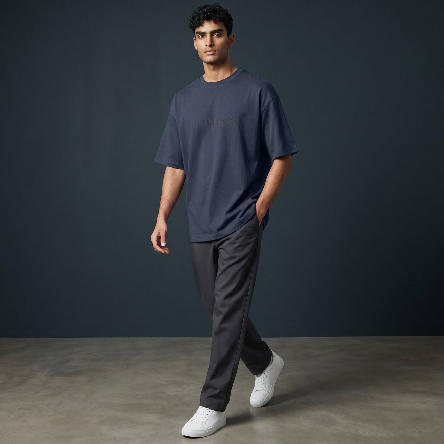 Omina navy blue 100% cotton oversized fit crew neck t-shirt with subtle Omina logo embossed on chest.