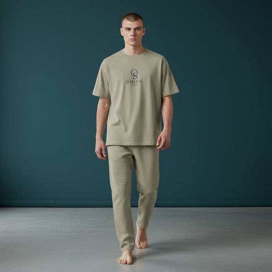 Omina Studio men's relaxed fit t-shirt in light olive green cotton with a subtle OS logo on the chest.